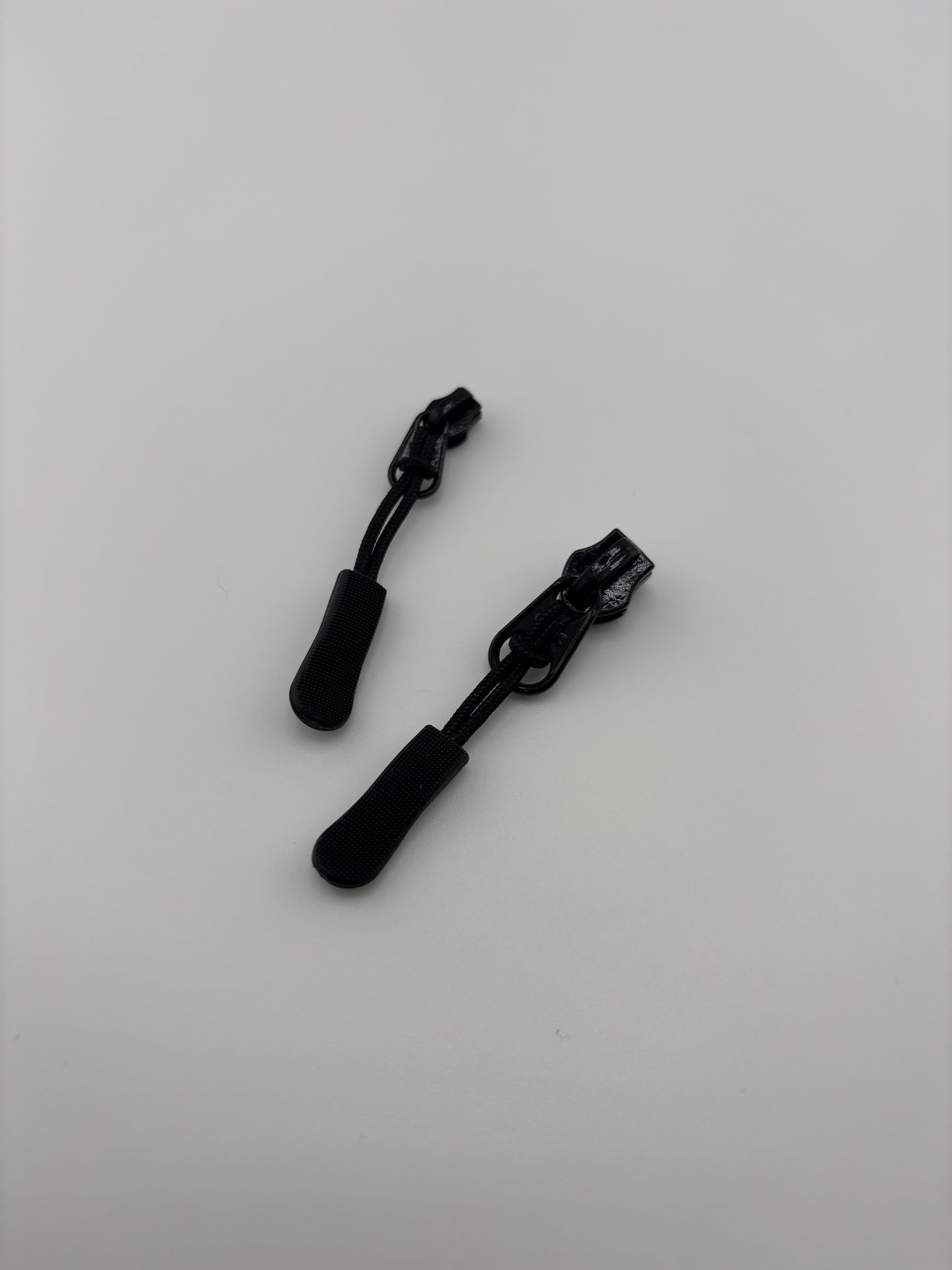 A Pair of Zipper Pulls